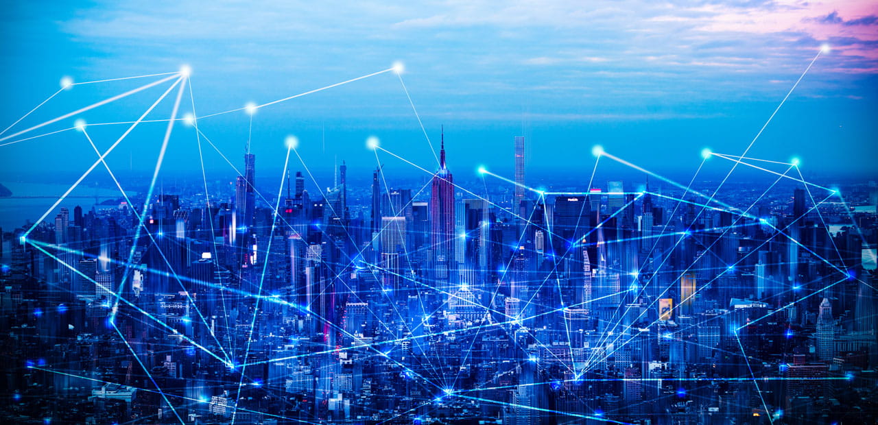 City skyline with digital network lines illustrating connectivity.