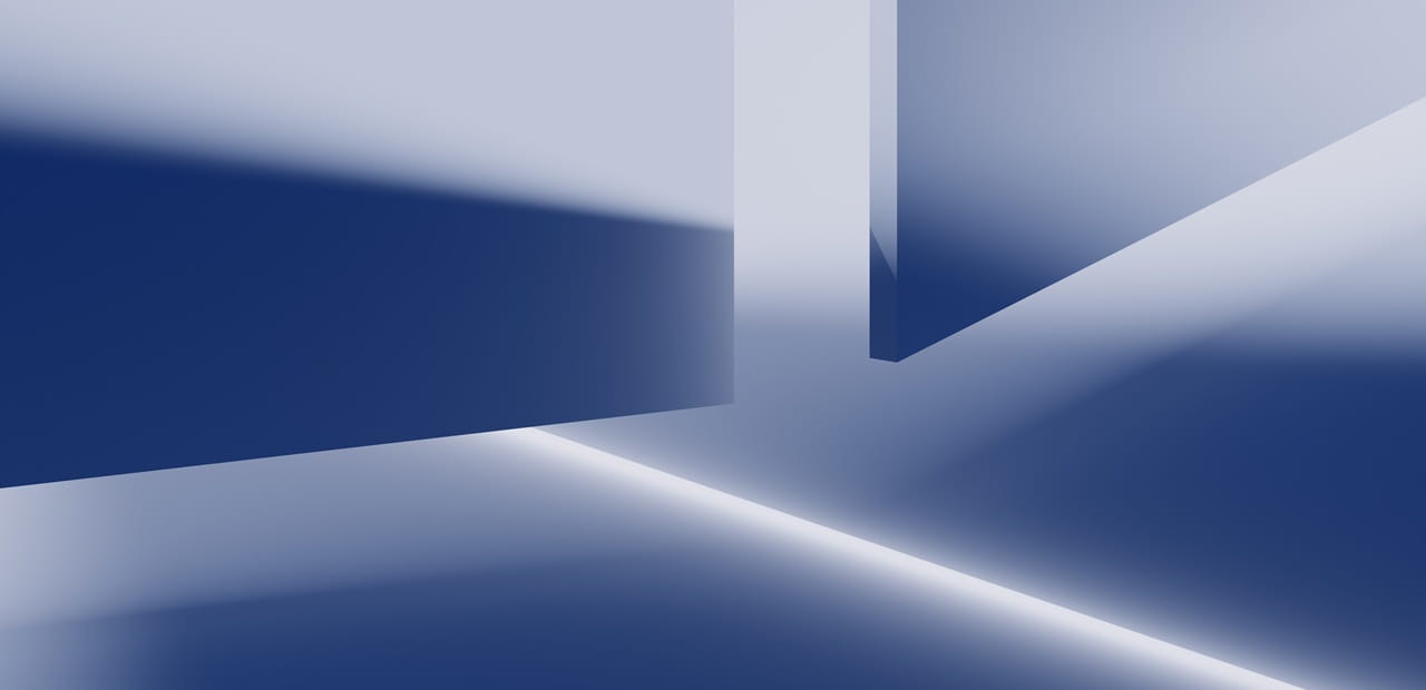 Abstract geometric shapes with sharp edges casting blue and white light and shadows.