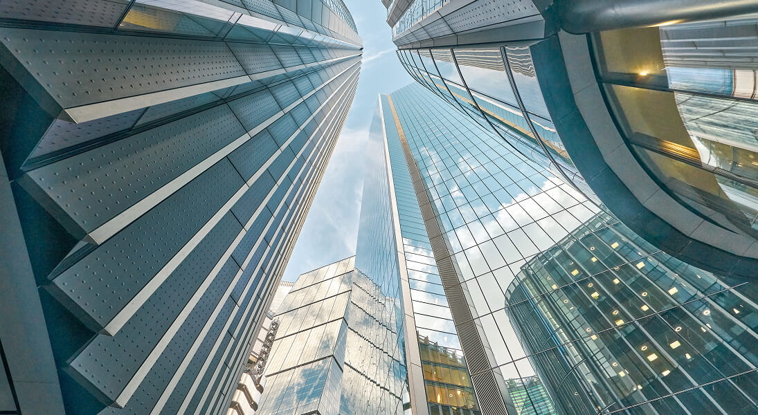 Looking up at corporate buildings